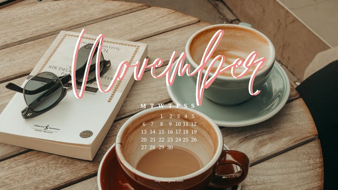 Inspire to Glow November 2023 Tech Background - Autumn Fall Aesthetic Vibe Photography - Parisian café - empty coffee mugs, book and sunglasses on a table - desktop wallpaper with calendar